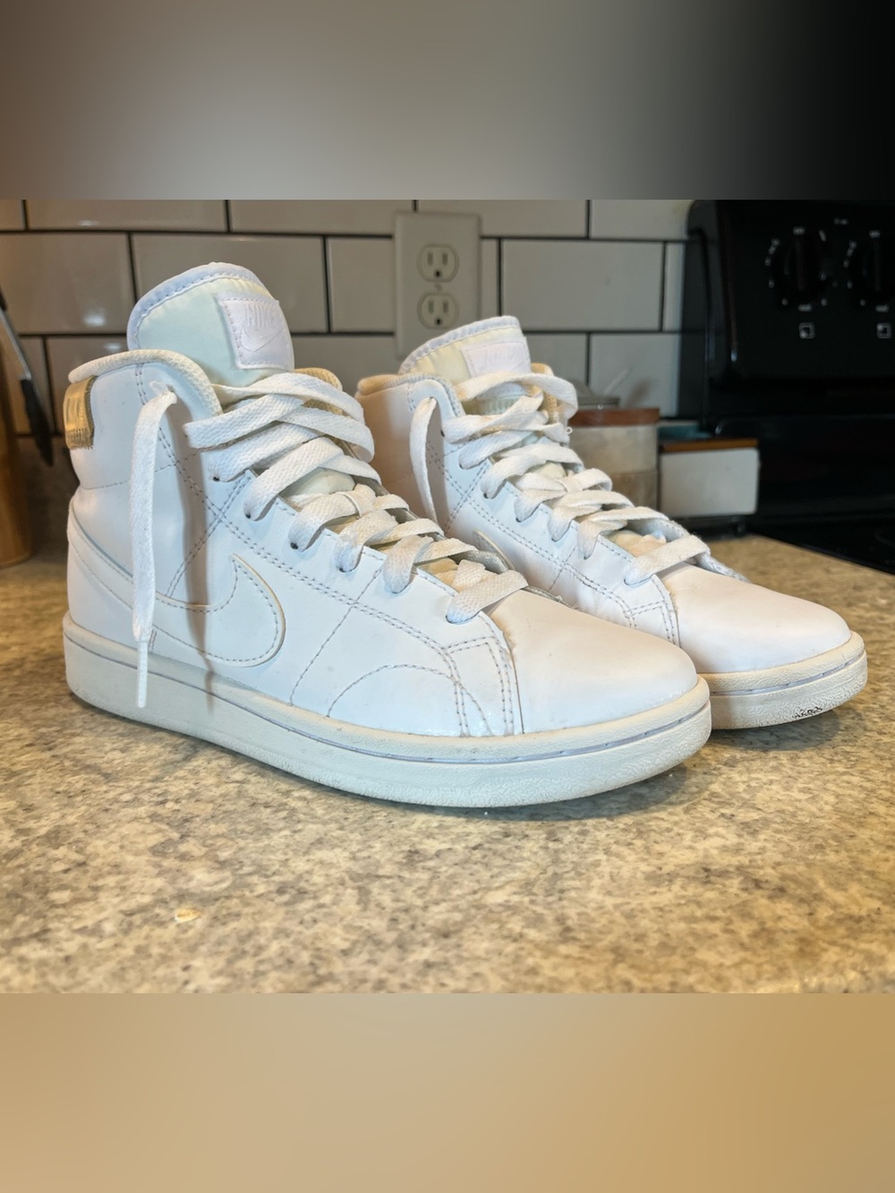 Women’s Nike White High-Top Leather Sneakers
